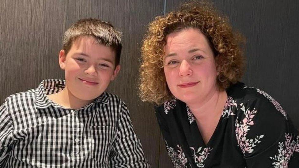 A mother and son pictured in a restaurant