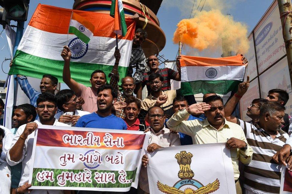 Indian residents in Ahmedabad on 26 February 2019 celebrate following an Indian Air Force (IAF) strike launched on a Jaish-e-Mohammad (JeM) camp in Pakistan.