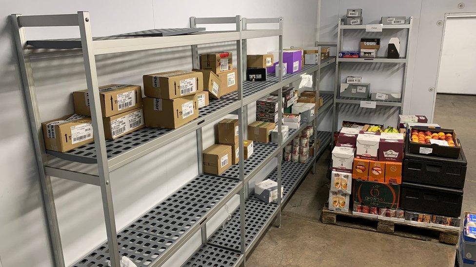 barely stocked food bank shelves