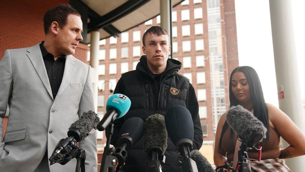 Jordan Trengove (centre) speaking to the media outside Preston Crown Court