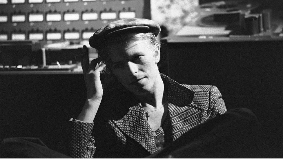 A black and white photo of David Bowie