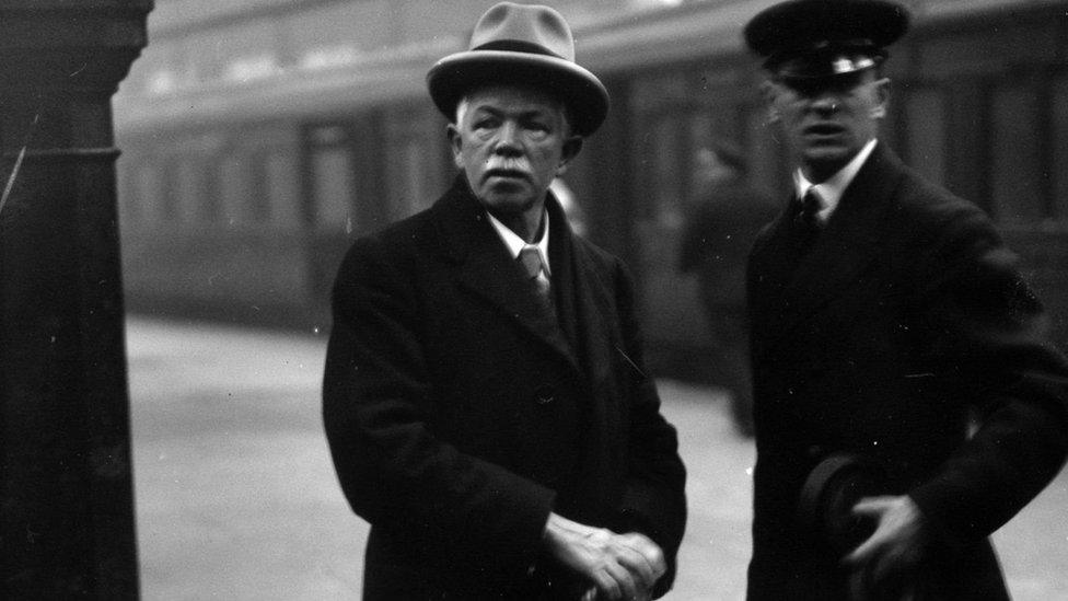 Joseph Clynes (left) arrives at Euston