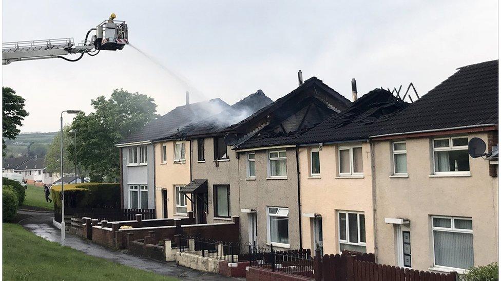 Fire service putting out fire at homes in County Antrim