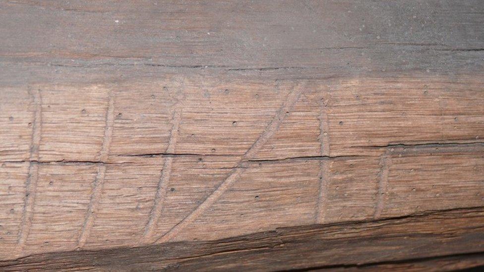 Carving in a wooden beam