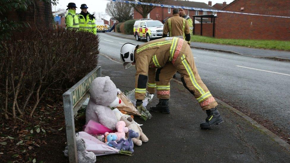 Firefighter laying flowers