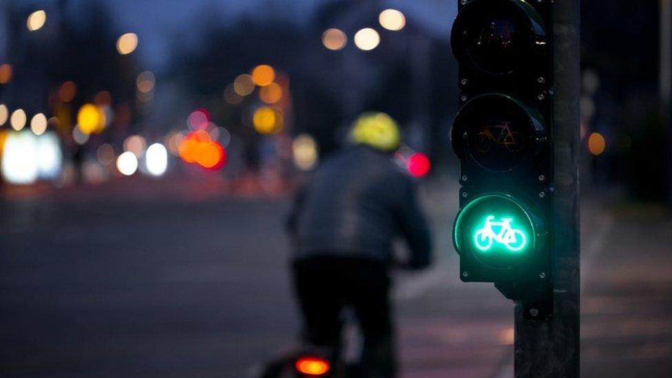 Cyclist at green light