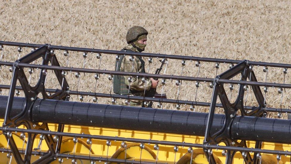 Russian soldier in a field in Ukraine