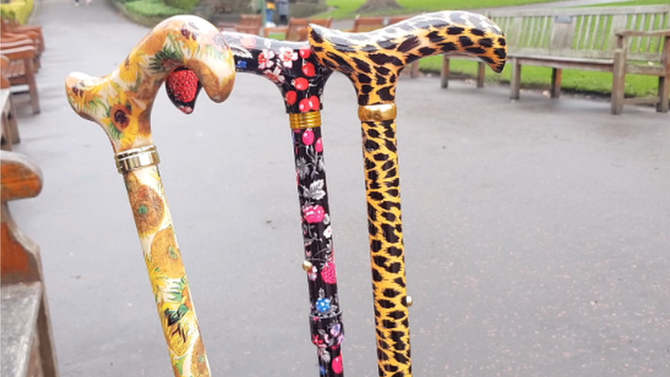 Three of Ellen's colourful, patterned walking sticks