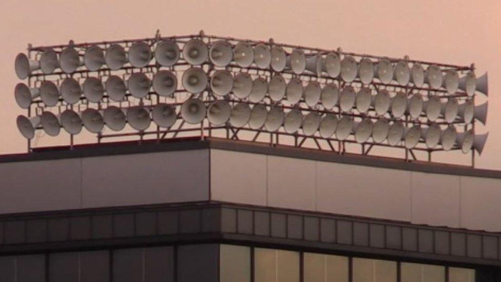 Loudspeakers on top of a building on Ipswich waterfront