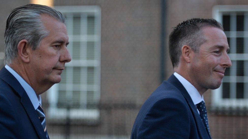 Edwin Poots and Paul Givan pictured in profile from the right hand side, both appear to be in motion