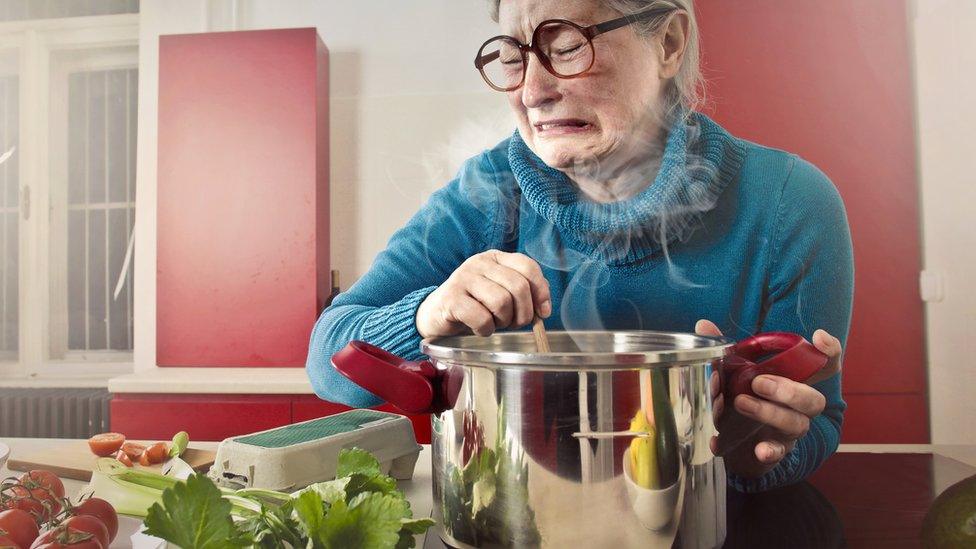 woman cooking veg