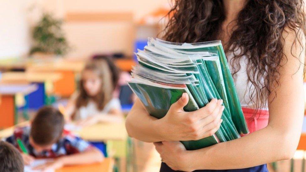 Teacher with books