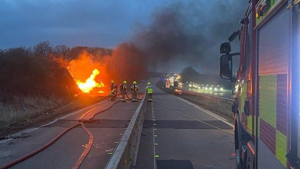 Fire crews fight a burning lorry