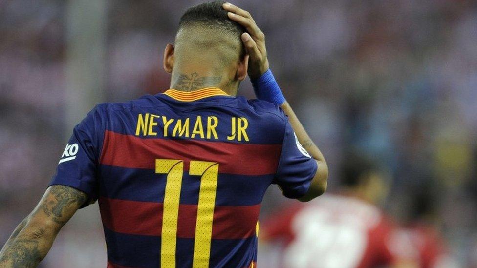 Barcelona"s Brazilian forward Neymar reacts during the Spanish league football match Club Atletico de Madrid vs FC Barcelona at the Vicente Calderon stadium in Madrid on September 12, 2015. AFP