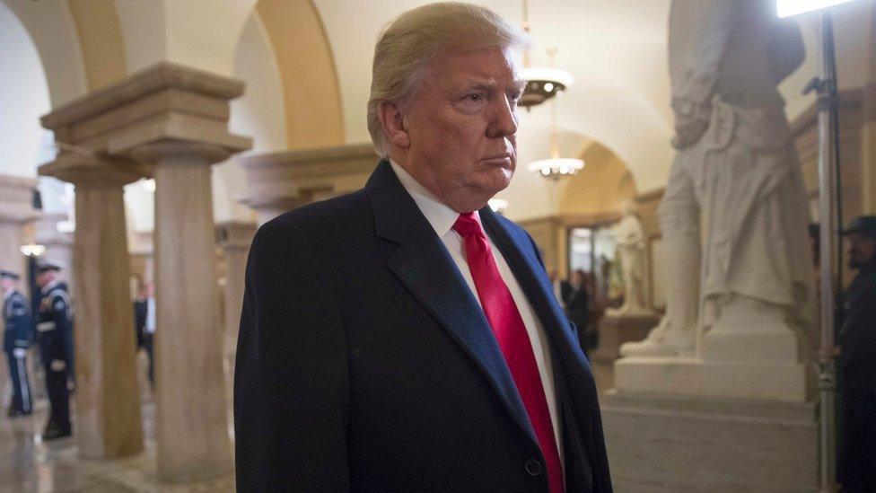 President-elect Donald Trump walks through the Crypt at the Capitol to his inauguration ceremony in Washington, Friday