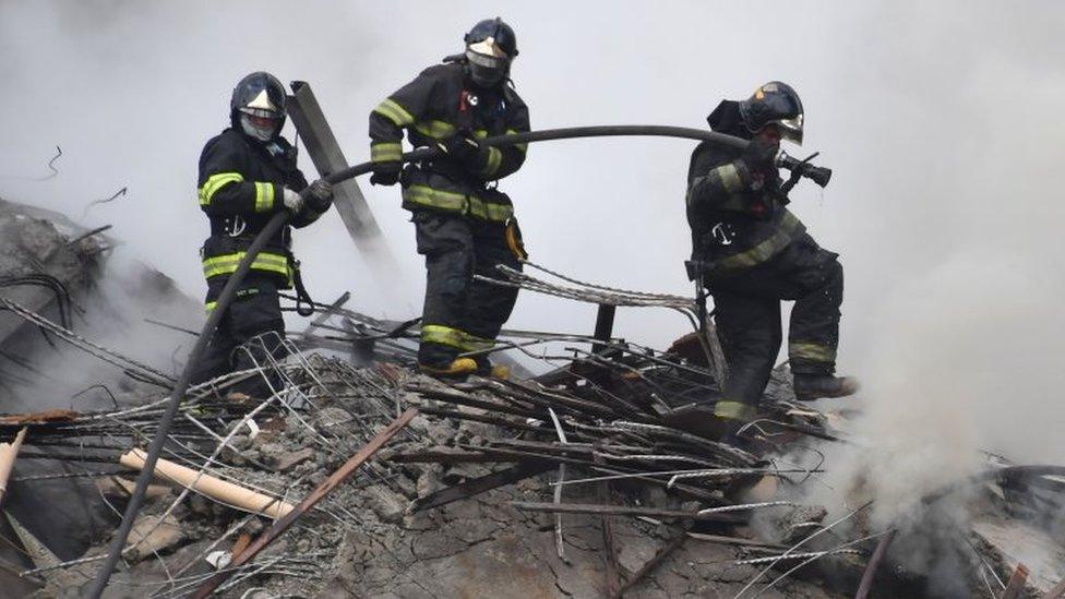 Firefighters work to extinguish the fire in a building that collapsed after catching fire in Sao Paulo, Brazil, on May 1, 2018.