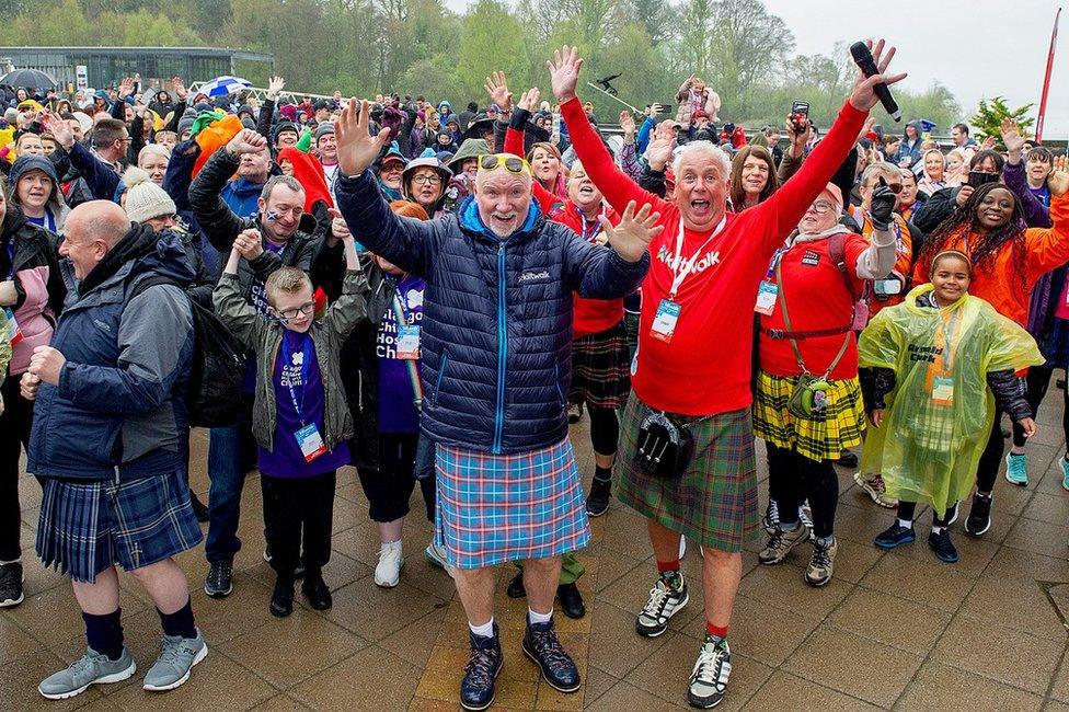 Sir Tom Hunter, front left in kilt, with other kiltwalkers