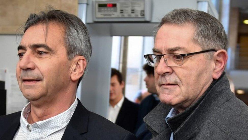 Pascal Fauret (right) and Bruno Odos arrive on 18 February, 2019 at the Assize Court of Aix-En-Provence