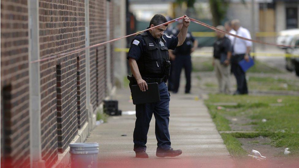 Chicago Police officers and detectives investigate a shooting where multiple people were shot on Sunday, August 5, 2018 in Chicago, Illinois