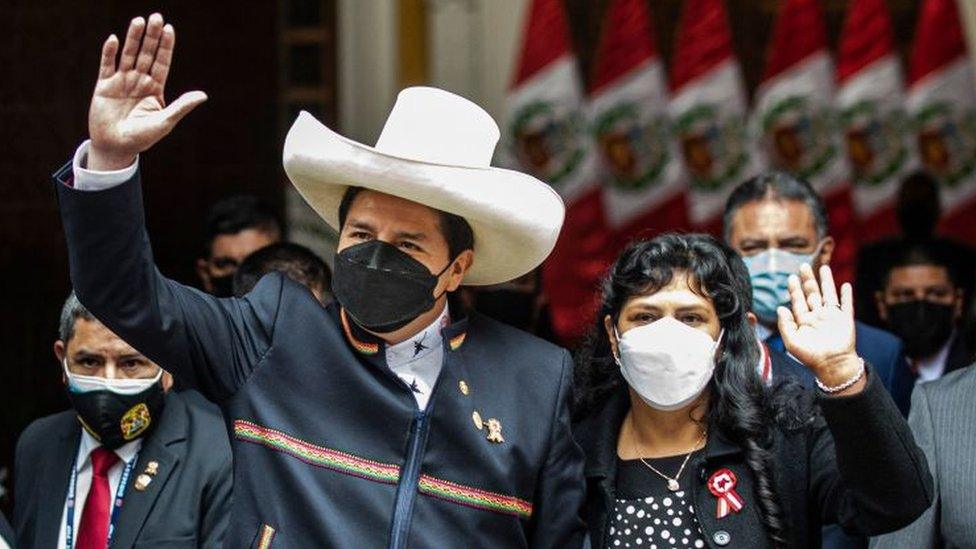 Peru's President-elect Pedro Castillo (L) leaves the Foreign Affairs Minister at Torre Tagle Palace next to his wife Lilia Paredes, before the inauguration ceremony in Lima, on July 28, 2021