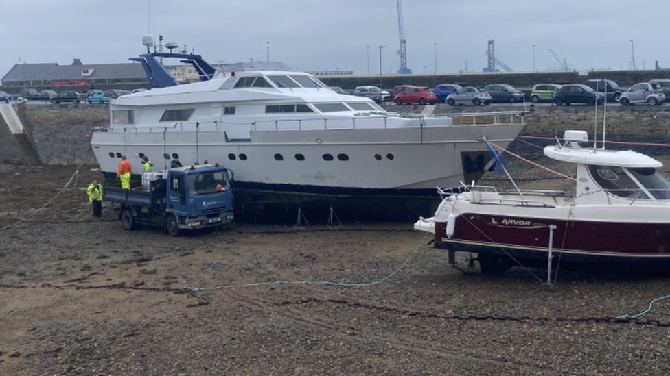 Motor cruiser on Guernsey hard