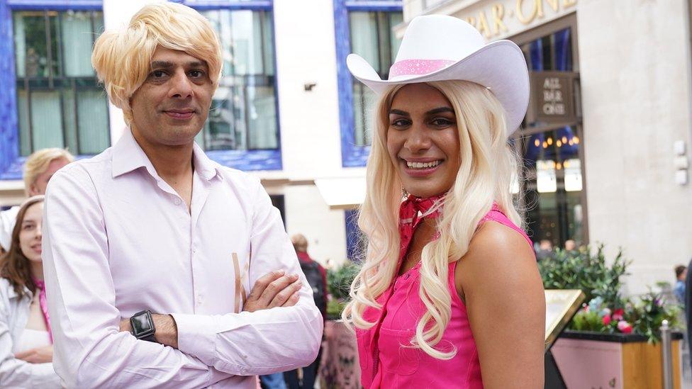 fans dressed as barbie and ken