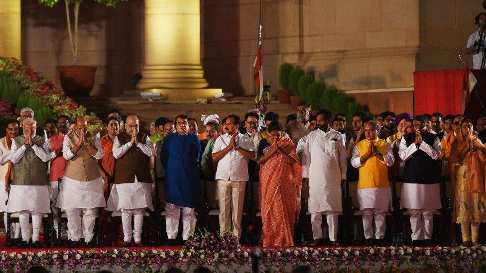 Prime Minister Narendra Modi and members of his cabinet stand for national anthem after taking oath during swearing-in ceremony, at Rashtrapati Bhavan, on May 30, 2019 in New Delhi, India.