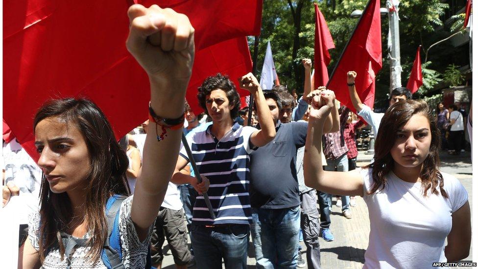 High school students chant slogans denouncing a suicide bombing in the Turkish border town of Suruc that killed 32 activists, during a demonstration in Ankara on July 23, 2015