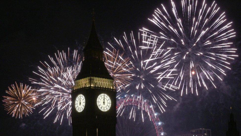 Fireworks light up the sky over Elizabeth Tower, also known as Big Ben and the London Eye in central London