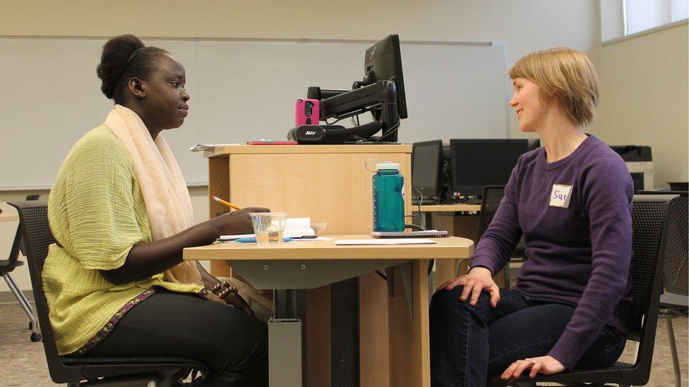 Nyamal Dei exchanges stories with newly elected Moorhead City Councilwoman Sara Watson Curry