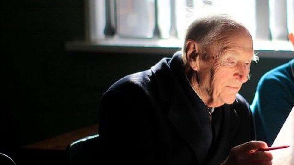 Liam Cosgrave sits in the classroom of his father's old school Mater Dei Primary School in Dublin with current pupil Morgan Campbell