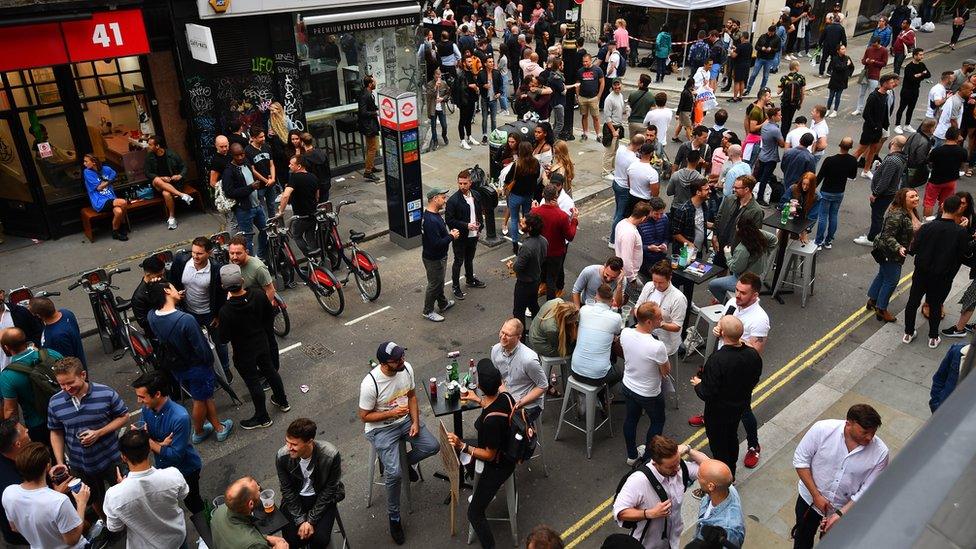 Drinkers gather in Soho