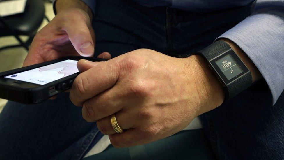 Person using HealthKit to log health activity on an Apple iPhone