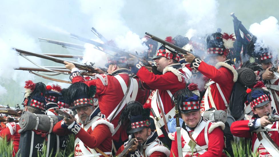 Men dressed as Scottish soldiers fight in a reeanactment of the battle of Waterloo on June 21, 2009 with some 1,200 others history enthusiasts from 20 European countries.