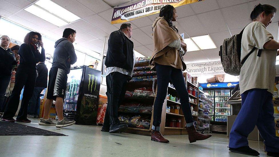 People lining up to buy powerball tickets