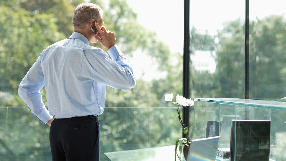 businessman looking out of window