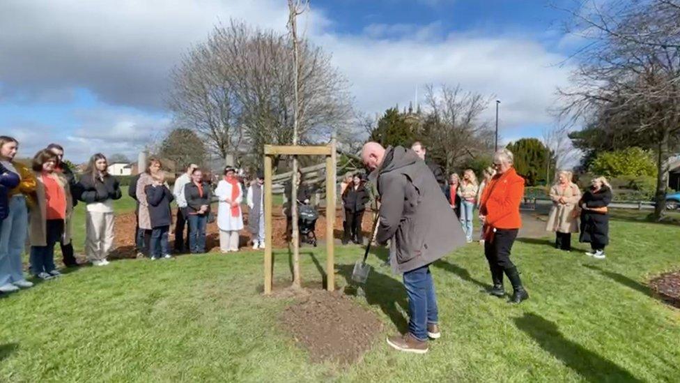 Family and friends gather for tree planting