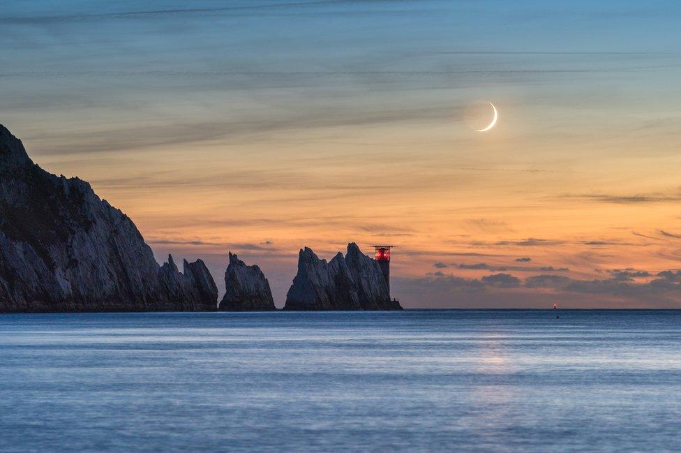 The 7% waxing crescent moon setting in the evening sky