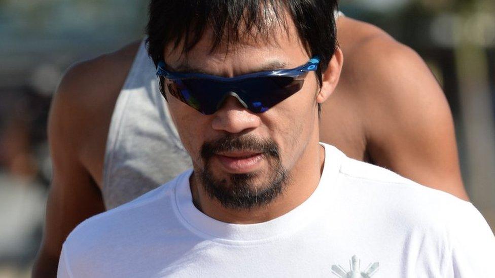 Philippine boxing great Manny Pacquiao (front) jogs along the sports complex in General Santos on the southern island of Mindanao on February 19, 2016