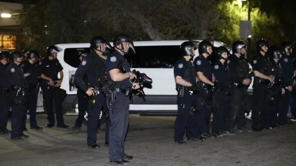 Guadalupe Garcia de Rayos is locked in a van that is stopped by protesters outside the Immigration and Customs Enforcement facility on 8 February 2017, in Phoenix