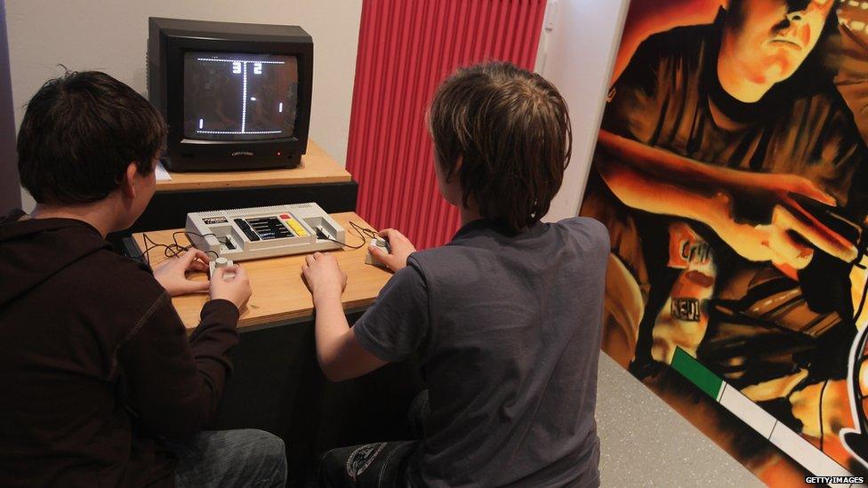 Visitors try out Pong, one of the first, commercially successful home computer video games, at the Computer Game Museum - January 2011