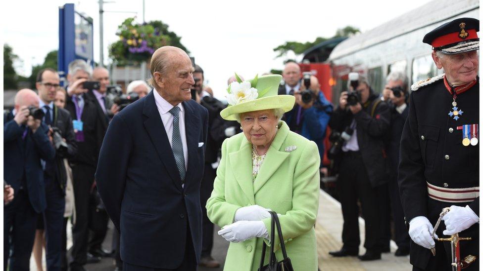 The Queen and the Duke Of Edinburgh arrive by steam train to open the new Bellarena Station village in 2016