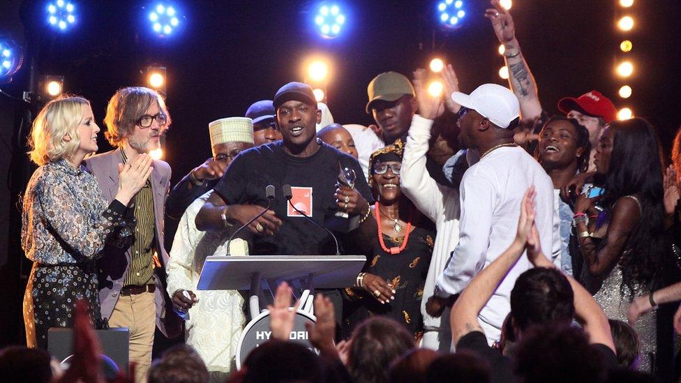 Skepta on stage with his friends and family at the Mercury Prize