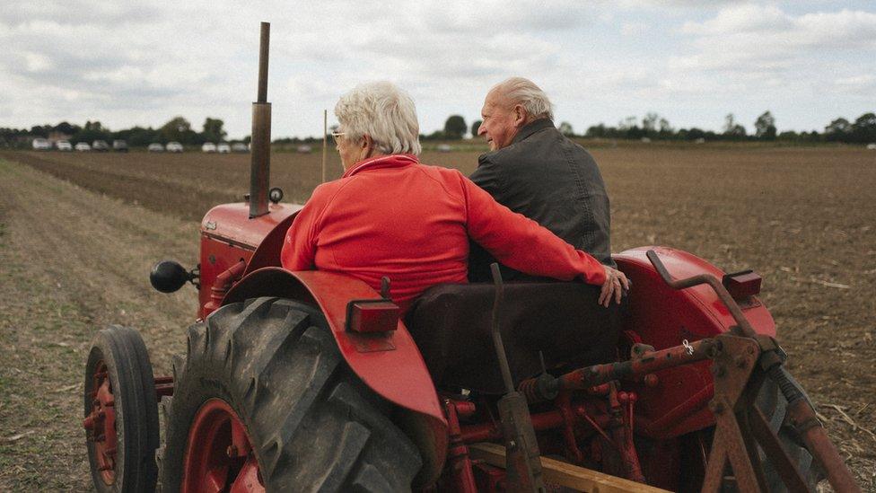 Catching a lift on a tractor