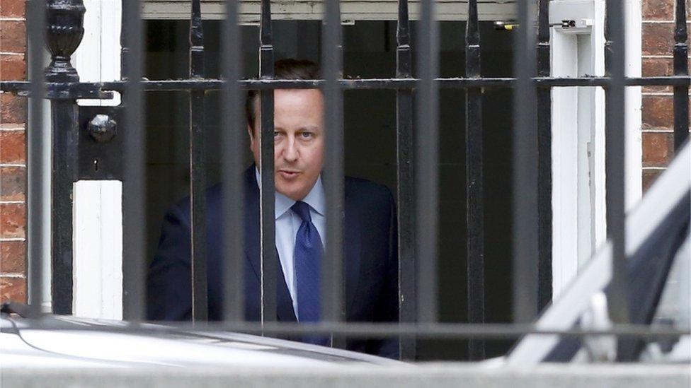 David Cameron leaves Downing Street through a rear entrance after his final cabinet meeting