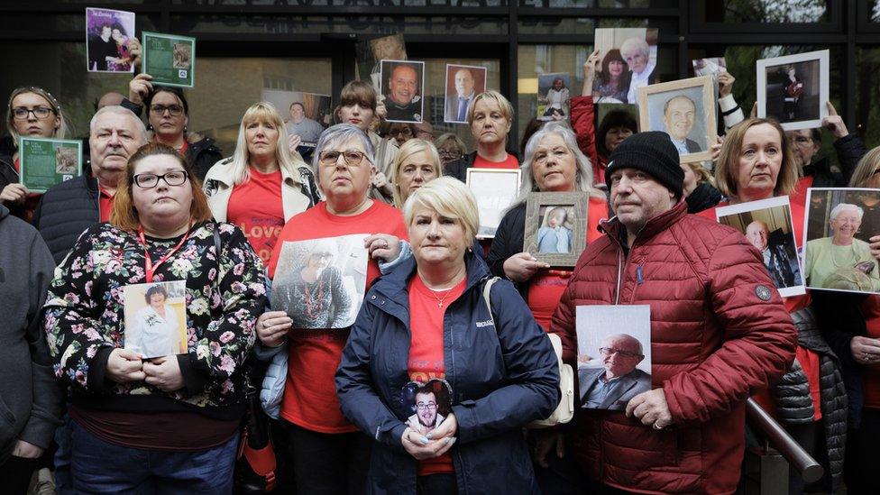 Covid bereaved families gather outside of the inquiry in Belfast