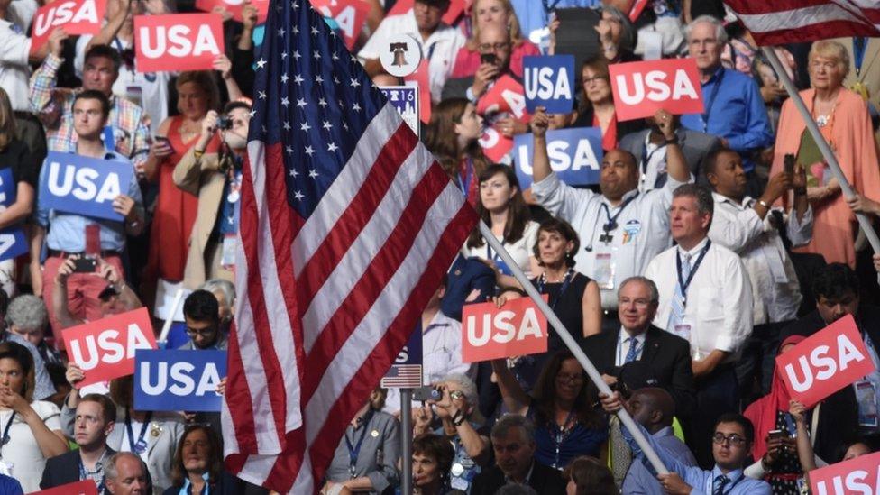 A man waves the US national flag as Khizr Khan addressed the democratic convention in Philadelphia, 28 July