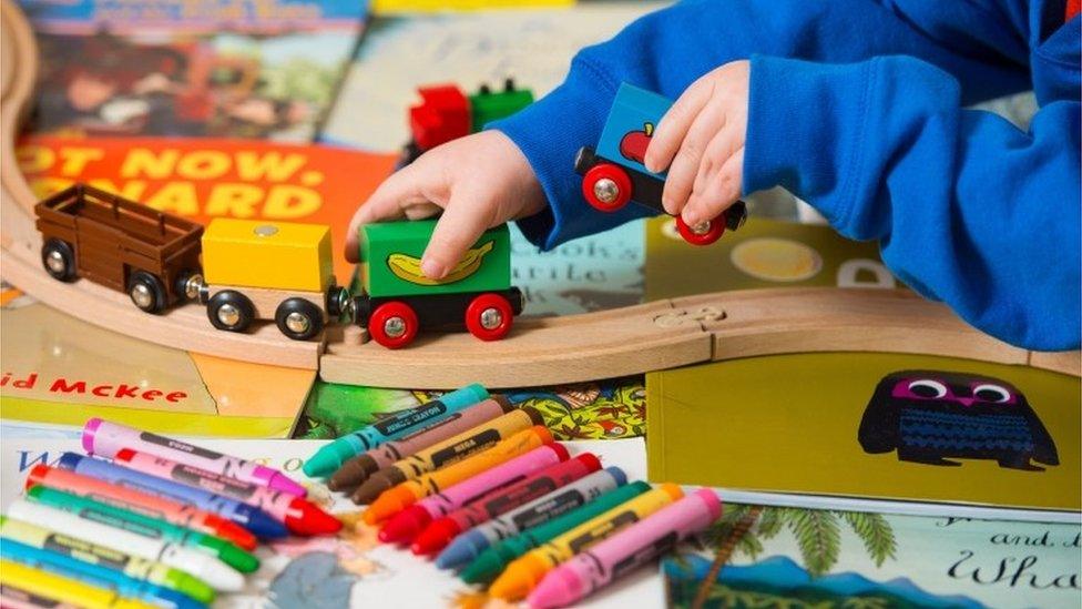 Toddler playing with toys