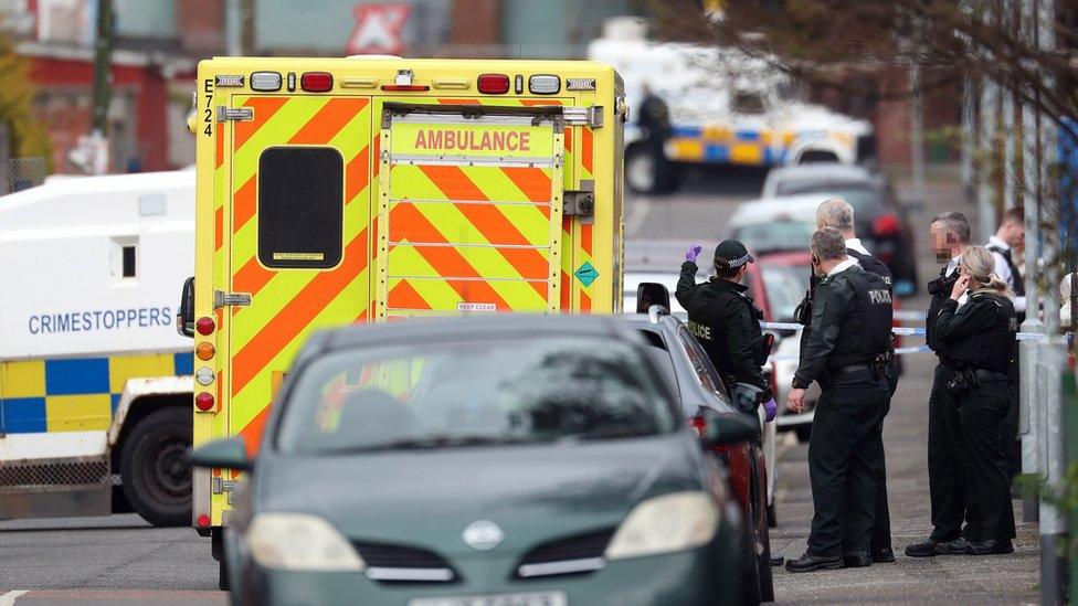 Police at the scene of the shooting in north Belfast