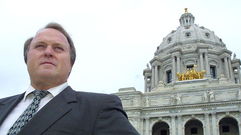 Dean Barkley stands in front of the Minnesota capitol building